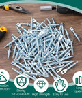 100 Piece 2 Inch Eye Lag Screws Featuring Self Tapping Drilling Points For Heavy Duty Construction And Home Reno Projects Includes Kickass Fastening Driver Bit For Quick No Sweat Installs scattered on a workbench.