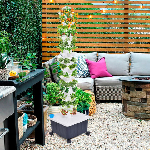 Vertical Hydroponic Growth Tower With 14 Layers And 70 Slots For Easy Balcony Garden on a patio setting with plants