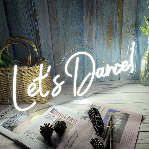 Lit Dance Neon Sign With Dimmer For Wall Decor Large LED Neon Light, on a rustic wood background with magazines.