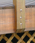 Top Shelf Construction Lag Screws 5 16 By 3 Inch Bronze Hex Fasteners 30 Pack holding wooden beams in a deck structure.