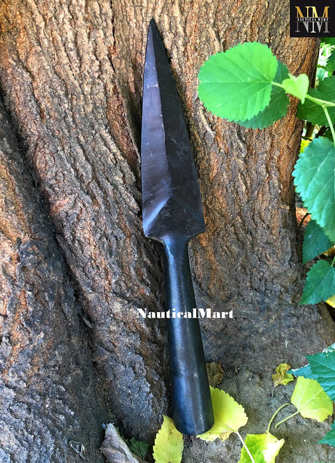 Hand Forged Viking Saga Iron Spear Point For Reenactment And LARP Carbon Steel Long Spearhead against a tree trunk.