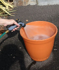 Using Hot Water Nozzle With Insulated Handle And Metal Core, Rubber Grip, Adjustable Spray From Gentle Mist To Powerful Jet on plants