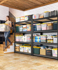 Two Pack Adjustable Garage Shelves With Side By Side Design Deliver 71 Inch Wide Storage For Garage Pantry And Kitchen Heavy Duty Build Perfect For 18 Gallon Storage Boxes Five Gallon Buckets Spare Tires Moving Boxes And More. Side view in garage with bins