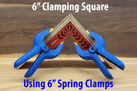 6 inch clamping square with 6 inch spring clamps securing wooden pieces on a workbench.