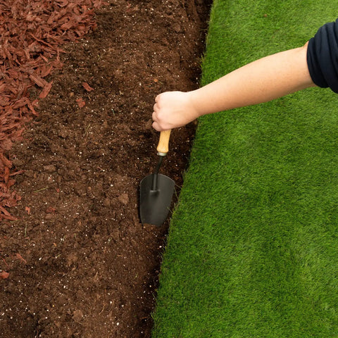 Preparing area for Heavy Duty Composite Landscape Edging With Anchoring Stakes, 4.5 Inch Straight Top Border, 40 Foot Kit, Black
