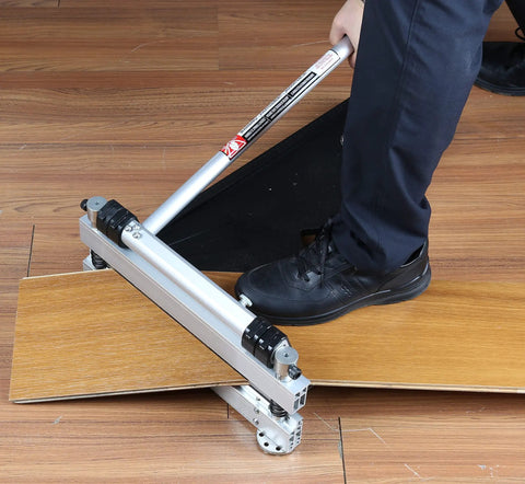 Person using 13 Inch Pro Laminate Floor Cutter for wide boards up to 330mm on laminate floor