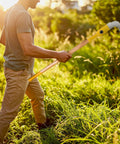 Person using Heavy Duty 47 Inch Long Handle Weeding Sickle with 14.75 Inch Curved Steel Blade for bramble removal