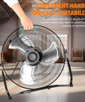 Heavy Duty 20 Inch Industrial Floor Fan With 4650 CFM Airflow, 3 Speed Settings, being tilted by a hand in a warehouse