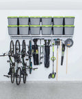 96 Inch Wide Wall Mounted Utility Storage Rack With 4 Bike Hooks and 20 Hooks organizing bikes and tools in a garage.