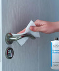 99 Percent Isopropyl Alcohol For Surface Cleaning Unscented 32 Fl Oz USA Made Methanol Free bottle and door handle being cleaned