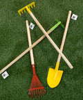Kids Gardening Tool Set With Wood Handles 4 Piece Mini Garden Tools For Little Helpers on grass, showing shovel, rake, hoe