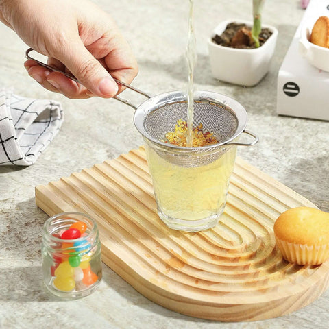 Pouring liquid through Ultra Fine Mesh Strainer With Handle Stainless Steel Kitchen Sieve 3.35 Inch Small Filter