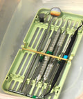 Top Shelf Number Thirty Three Rubber Bands Built Different For Daily Hustle Three And A Half Inch By One Eighth Inch Natural Beige Elastic Loops securing dental tools in a container.