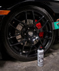Applying tire dressing with Wonder Wave Durafoam Tire Shine Applicator Pads With Contour Wave Design on a large SUV tire