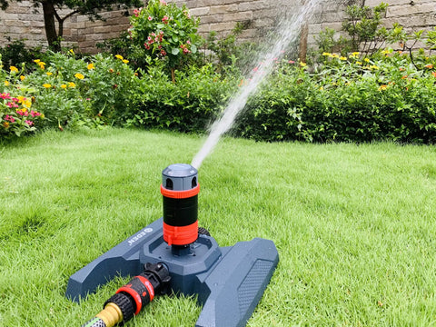 Four Pattern Adjustable Rotary Sprinkler With Quick Connect Starter Set For Lawn And Garden, 360 Degree Coverage in operation on grass