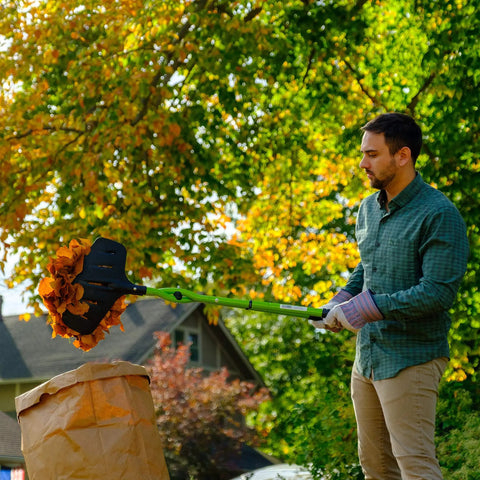Person using Gator Grabber Telescoping Leaf Cleanup Tool With Adjustable Handle Powder Coated Steel Shafts And Heavy Duty Poly Fiber Jaws