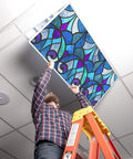 Person installing Fluorescent Light Covers For 2x4 Ceiling Fixtures With Stained Glass Design, 22.38 Inches By 46.5 Inches, 4 Pack.