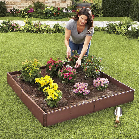 Woman gardening in All Weather Raised Garden Bed Kit With 8 Adjustable Panels For Easy Backyard Planting, Durable Polypropylene Planter Box