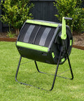 All-In-One Backyard Compost Kit With 48 Gallon Tumbler on green lawn, showing dual chamber design for organic waste composting.