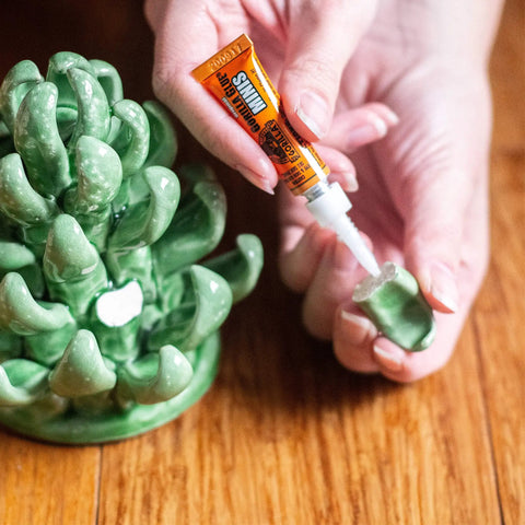 Applying Original Brown Waterproof Polyurethane Glue That Expands Into Materials For A Beast Bond Heavy Duty Adhesive to ceramic piece