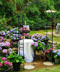 Heavy Duty Rustproof Iron Garden Arbor Wedding Arch, 95.3 Inch High By 45 Inch Wide in flower-filled outdoor setting