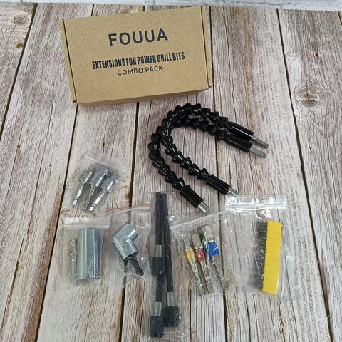 Crazy Handy Flexible Drill Bit Extension And Universal Socket Wrench Set With 105 Degree Right Angle Attachments displayed on wood