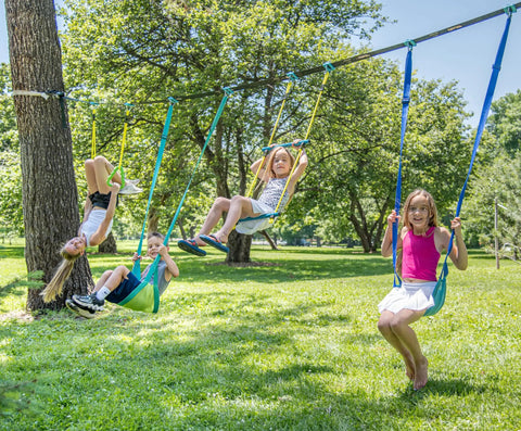 Children playing on Backyard Gymnastics And Swing Set Kit With 36 Ft Slackline, Monkey Bars, Two Swings, Double Trapeze Bar in a sunny yard.
