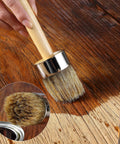Chalk And Wax Paint Brush, 2 Inch Round Head For Furniture Projects with natural bristles applying finish on wood surface