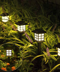 12 Pack Solar Path Lights Outdoor Walkway Garden Landscape Driveway Waterproof Warm White Solar Powered Lights glowing at night