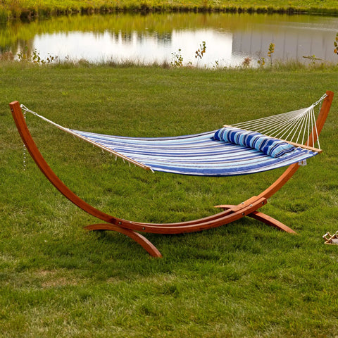 Curved Wood Hammock Stand For Outdoor Use Fits Most 9 To 12 Foot Hammocks 13 Foot Overall Length 400 Pound Capacity Built To Last Two Person Frame In Weather Ready Larch Wood in a grassy yard.