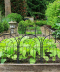 Sturdy Rustproof Garden Fence Panels 11ft Long By 21in High 10 Pack No Dig Metal Fence For Yard Dog Barrier Pet Safe Outdoor Border Decorative Garden Edging For Flower Beds Patio And Lawn surrounding green plants in a garden.