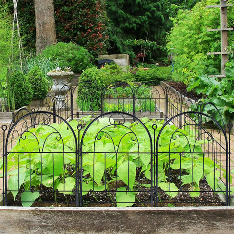 Sturdy Rustproof Garden Fence Panels 11ft Long By 21in High 10 Pack No Dig Metal Fence For Yard Dog Barrier Pet Safe Outdoor Border Decorative Garden Edging For Flower Beds Patio And Lawn surrounding green plants in a garden.