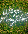 27.5 Inch Will You Marry Me Neon Sign With Dimmer Switch For Wedding Wall Decor 12V LED Neon Light against floral backdrop