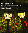6 Pack Solar Pathway Lights Outdoor LED Garden Lights illuminating flower bed at night with warm glow