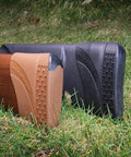 Slip-On Decelerator Recoil Pad For Long Guns, Easy DIY Install, Medium Black on rifle stock in grass setting