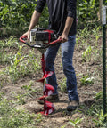 Person using 10 Inch Diameter 36 Inch Long Earth Auger With Fishtail Point And Flex Coil Shock Spring For Heavy Duty Drilling