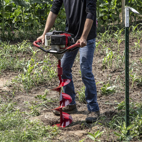 Person using 10 Inch Diameter 36 Inch Long Earth Auger With Fishtail Point And Flex Coil Shock Spring For Heavy Duty Drilling