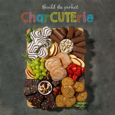 Charcuterie board with Soft Honey Buns Pastries Pack With Cinnamon Honey Glaze, fruits, nuts, and chocolate treats.