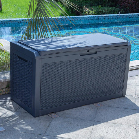 Huge 100 Gallon Outdoor Resin Deck Box With Lockable Lid for patio furniture cushions and garden tools, dark grey by pool.