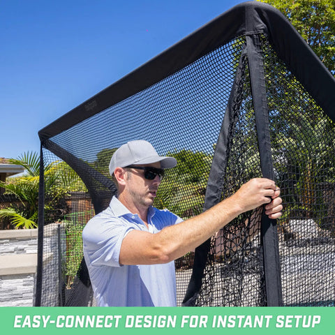 Man setting up Elite Shank Net for Golf Hitting Nets and Simulator Enclosures with Easy Attach Hook And Loop System outdoors