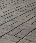 Premium Patio Paver Sealer Low Gloss Water Based Clear Stone Sealant Tough As Nails For Driveways on a herringbone patterned patio.
