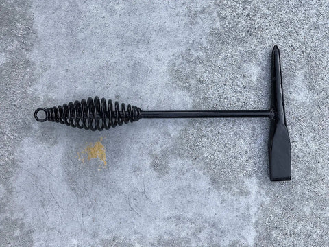 Tough As Nails Welding Chipping Hammer With Comfort Grip Spiral Handle and Anti Rust Tempered Steel Head on a concrete surface.