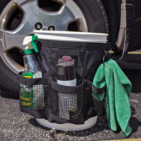 Exterior Bucket Organizer For 5 Gallon Buckets With Dope Quick Dry Mesh Pockets For Car Supplies Keeps Soap And Water In The Bucket While Wet Gear Dries Fast Black AB30060 in use, showing cleaning supplies and a green cloth.