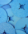 Close-up of 36-grit zirconia resin fiber discs for angle grinder, showing surface texture and center holes for fastening.