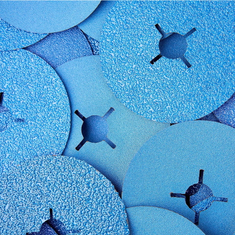 Close-up of 36-grit zirconia resin fiber discs for angle grinder, showing surface texture and center holes for fastening.