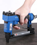 Job Site Tough 18 Gauge Pneumatic Brad Nailer Stapler Duo With Touch Trigger Safety Lock shown in hand on wooden surface.