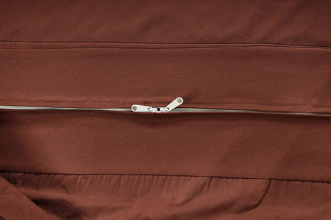 Close-up of a zippered Full Size Cotton Futon Cover Rust Slipcover For Sofa Bed And Foldable Armless Couch