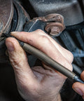 Using a prick punch from the Hammerless Three Piece Tool Set With Center Punch Prick Punch Cold Chisel Hammer And Hinge Pin Remover