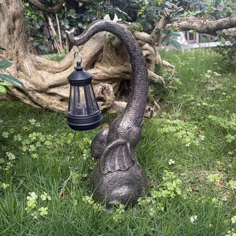 Outdoor Solar Powered Elephant Garden Statue With LED Lantern Lights on green lawn