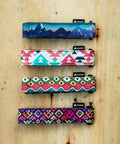 Rockband Frame Carrying Strap For Inner Tubes And Bike Tools, straps in four colorful designs on wooden background